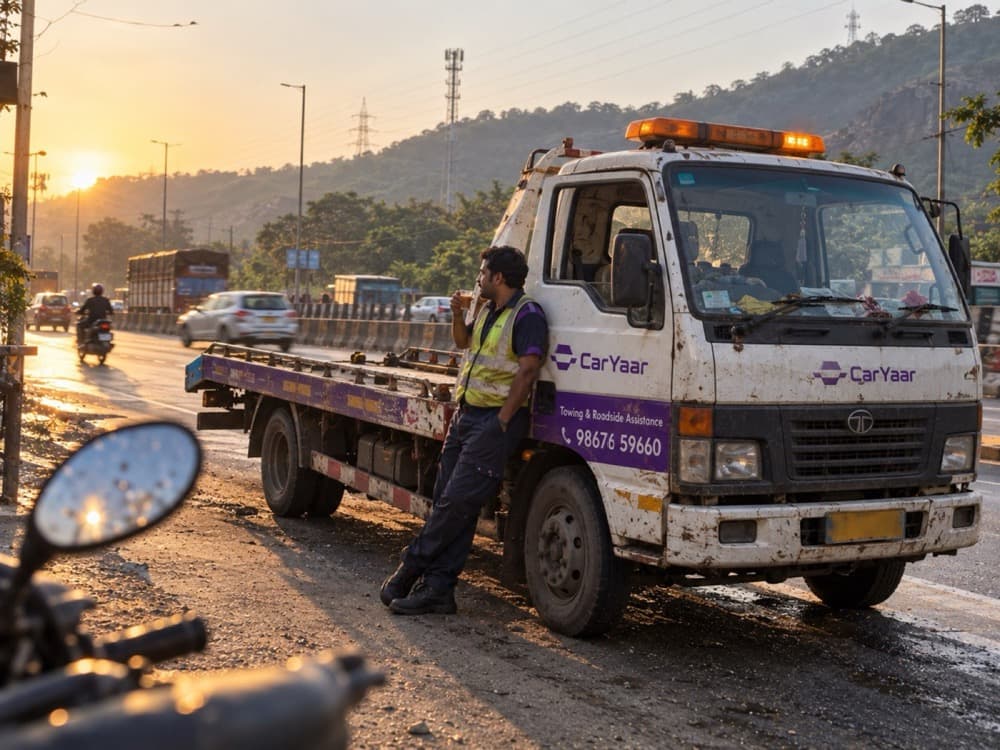 A CarYaar flatbed operator at sunset on the old Mumbai to Pune highway